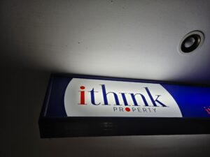 A clean illuminated sign after pressure washing