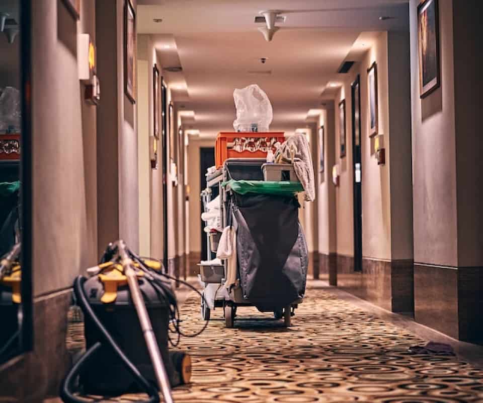 Cleaning trolly in a hotel hallway.
